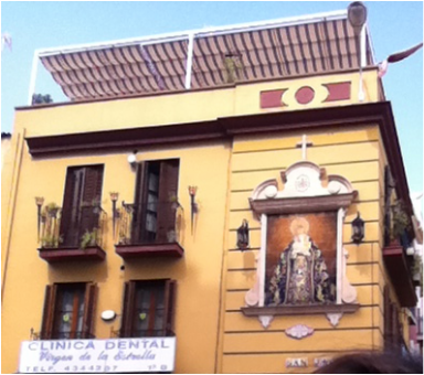 religiousity on display by private buildings in Seville's Triana district in Spain